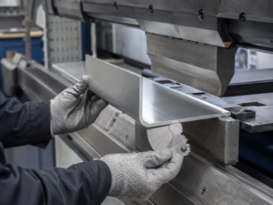 Aluminum sheet bend radius inspection at a press brake